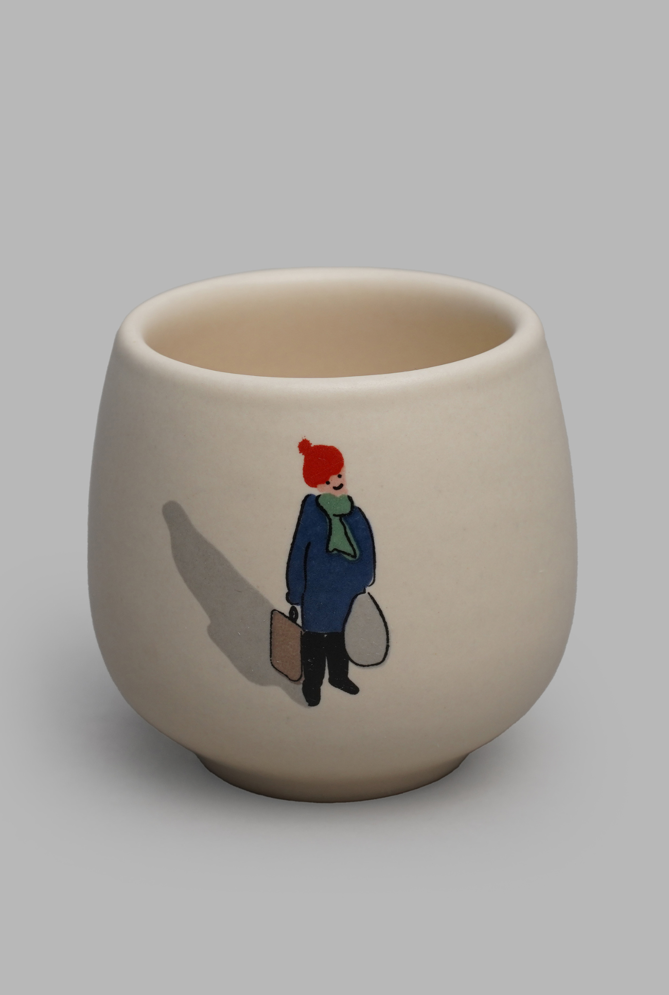 MAN WITH A SUITACSE MUG