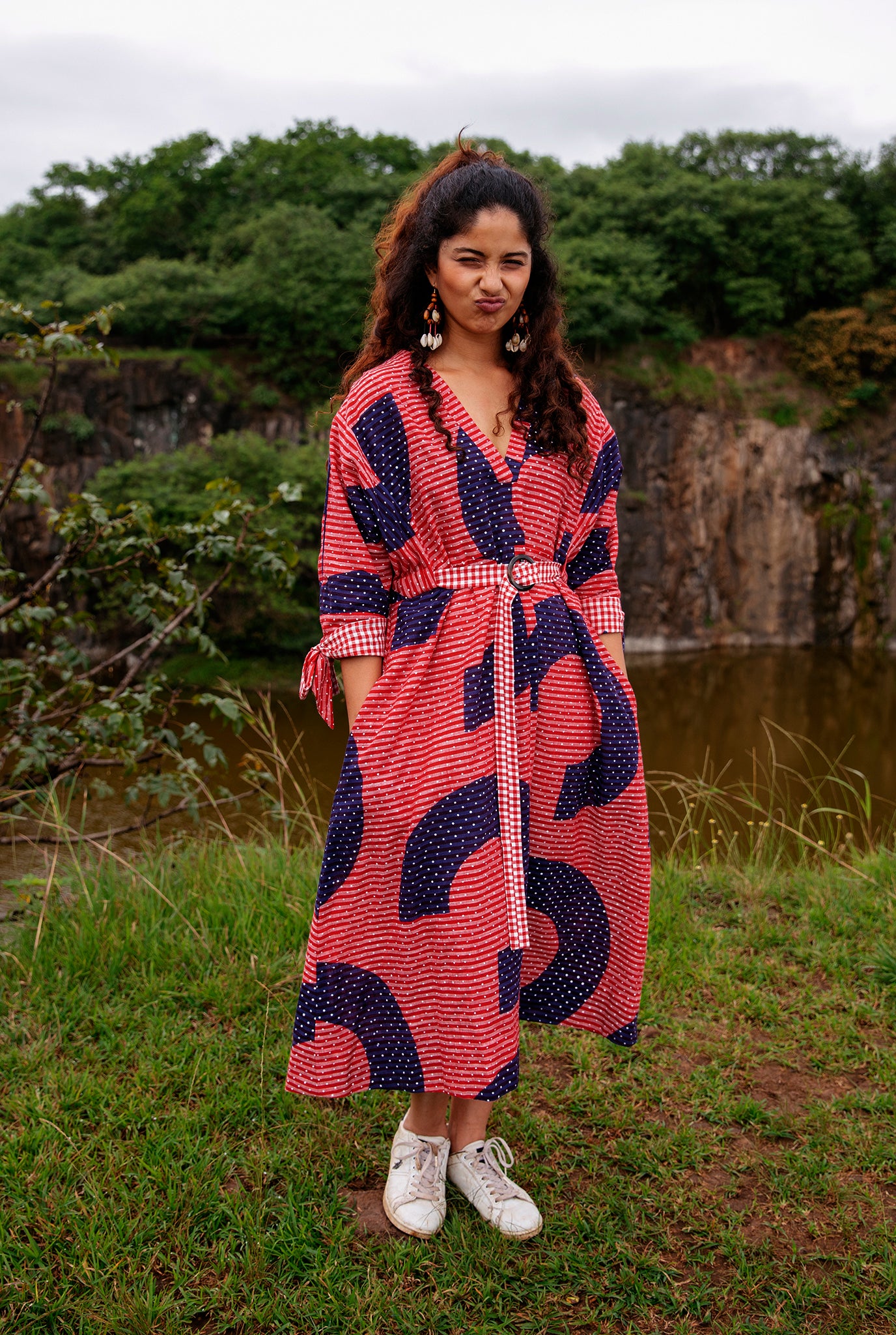 sustainable-handmade-handcrafted-jodi-thejodilife-graphic-hand-block-print-textured-cotton-red-blue-dress-relaxed-loose-fit-attached-belt-cinch-waist-complementing-gingham-checks