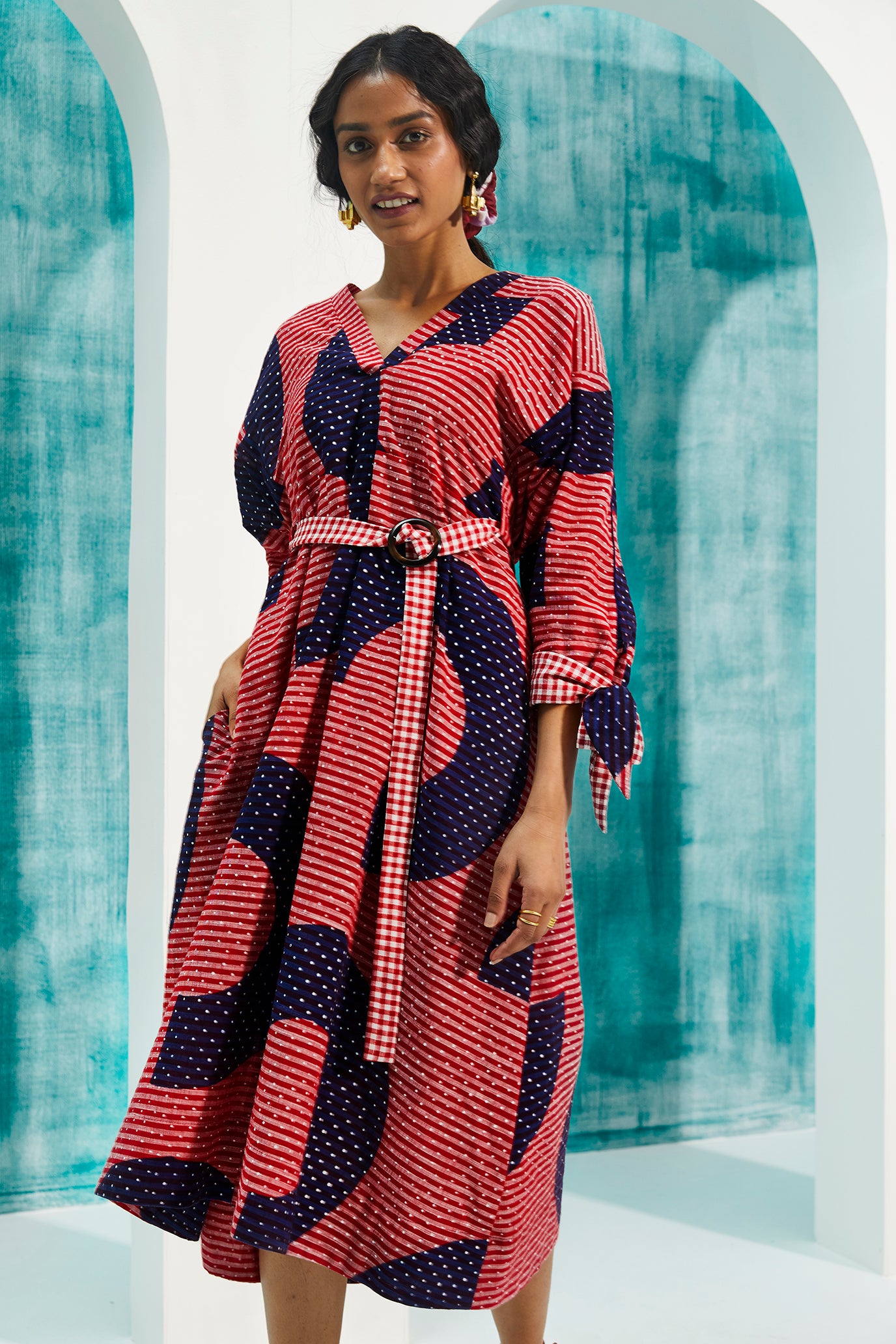 sustainable-handmade-handcrafted-jodi-thejodilife-graphic-hand-block-print-textured-cotton-red-blue-dress-relaxed-loose-fit-attached-belt-cinch-waist-complementing-gingham-checks